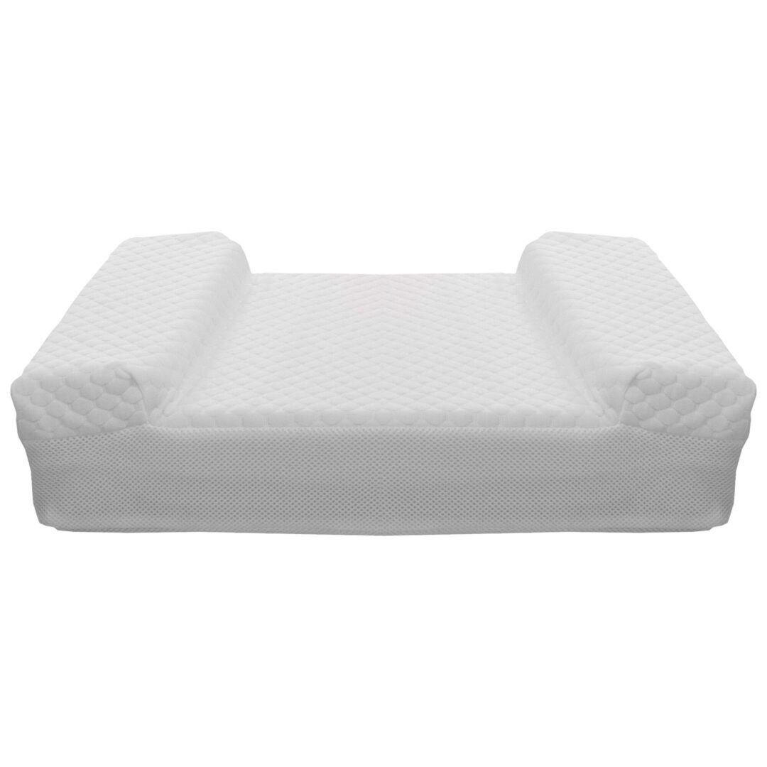 A white couch with a cover on it